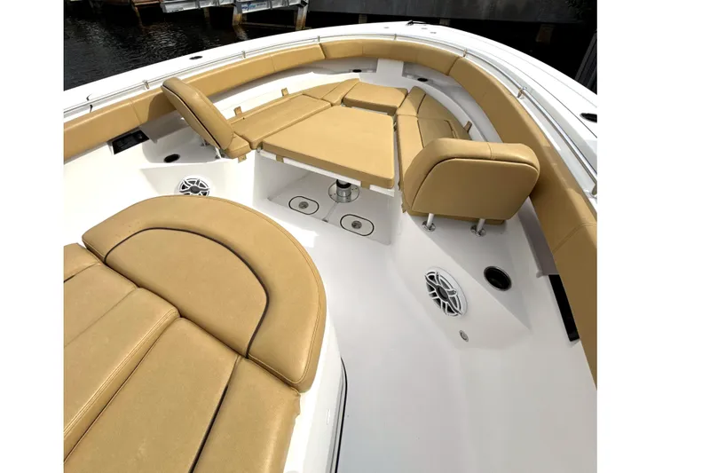 Slide: The Image of 2023 Sportsman Open 352 Center Console with tan seating and spacious deck layout. - 18