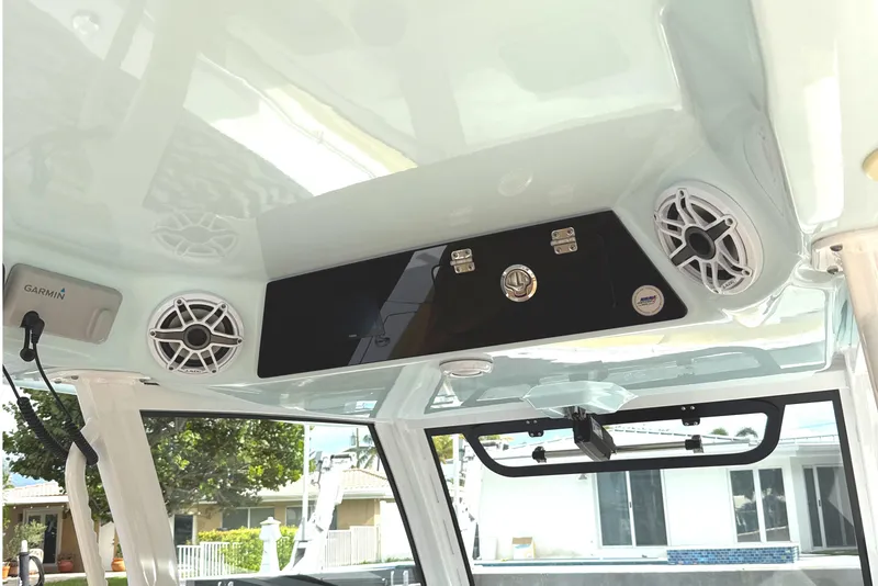 Slide: The Image of 2023 Sportsman Open 352 Center Console interior with speakers and Garmin equipment. - 26