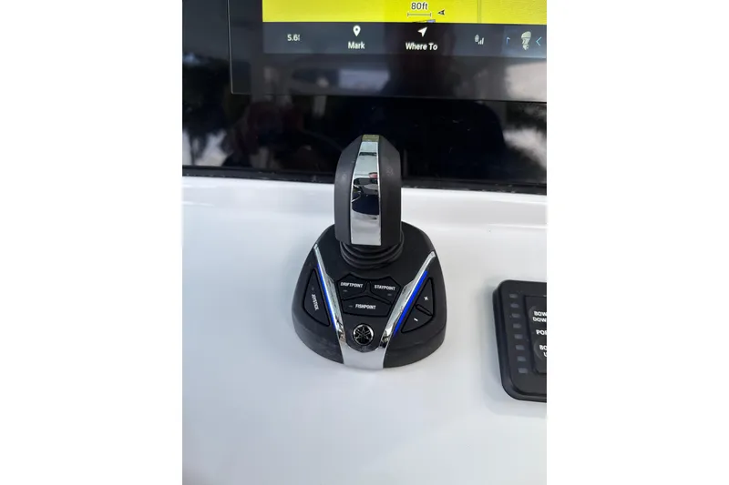 Slide: The Image of Control panel of 2023 Sportsman Open 352 Center Console boat, featuring joystick and display. - 29