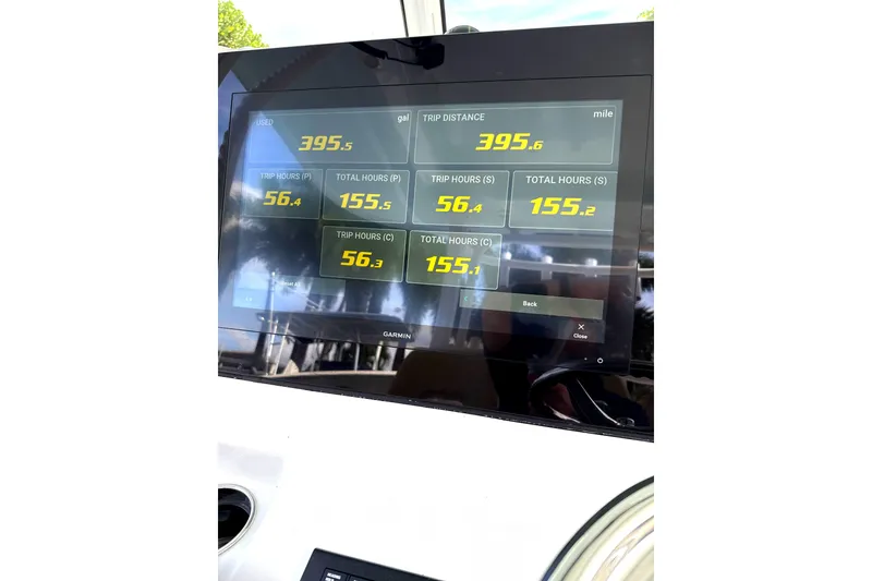 Slide: The Image of 2023 Sportsman Open 352 Center Console dashboard displaying trip data and fuel usage. - 31