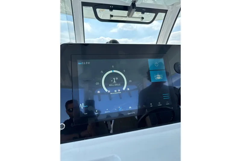 Slide: The Image of 2023 Sportsman Open 352 Center Console dashboard with digital display showing roll angle. - 32