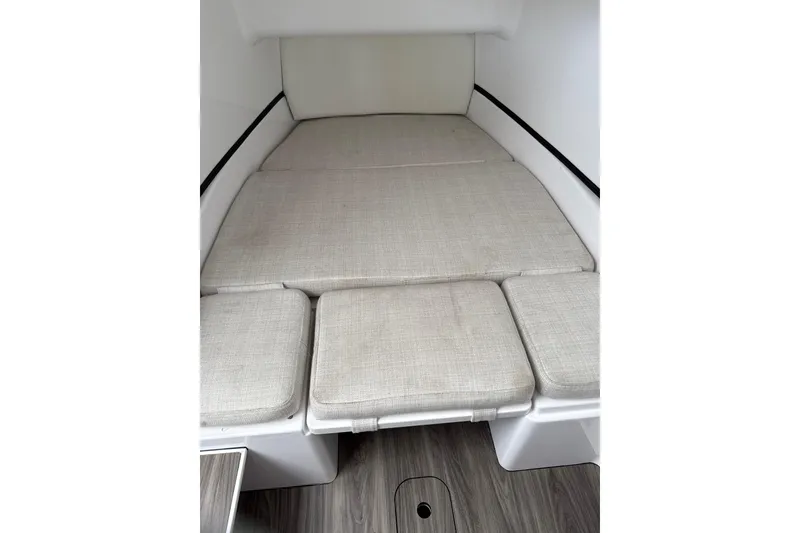 Slide: The Image of 2023 Sportsman Open 352 Center Console cabin interior with cushioned seating. - 37