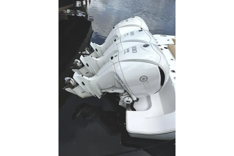 Slide: The Image of Triple Yamaha outboard engines on a 2023 Sportsman Open 352 Center Console boat. - 46