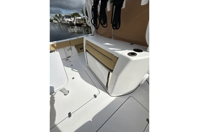 Slide: The Image of 2023 Sportsman Open 352 Center Console boat interior with seating and cup holders. - 51