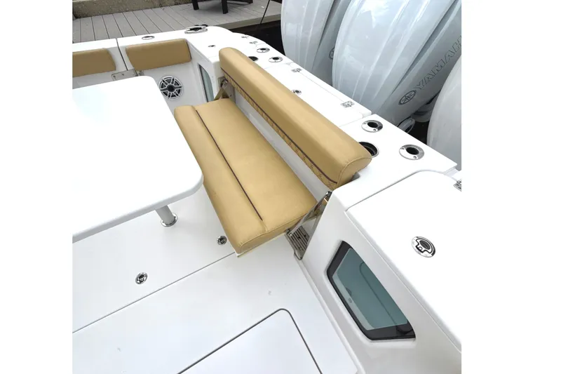 Slide: The Image of 2023 Sportsman Open 352 Center Console with tan seating and white deck. - 52