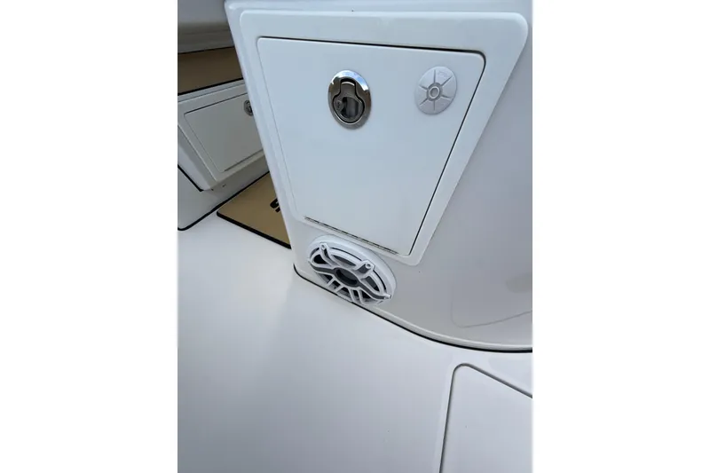 Slide: The Image of 2023 Sportsman Open 352 Center Console boat interior detail with speaker and storage compartment. - 54