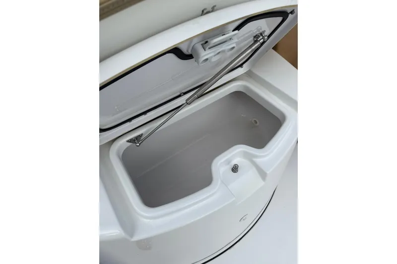 Slide: The Image of Open storage compartment on 2023 Sportsman Open 352 Center Console boat. - 64