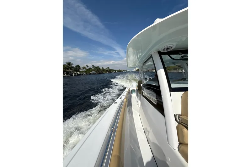 Slide: The Image of 2023 Sportsman Open 352 Center Console cruising on a sunny day. - 74