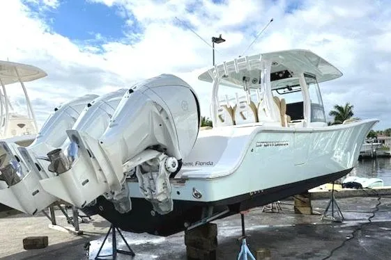 Slide: The Image of 2023 Sportsman Open 352 Center Console boat with dual engines on display. - 76