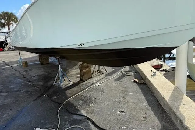 Slide: The Image of 2023 Sportsman Open 352 Center Console boat on dry dock, side view. - 77