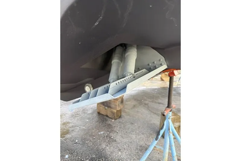 Slide: The Image of 2023 Sportsman Open 352 Center Console boat hull detail on support stands. - 78