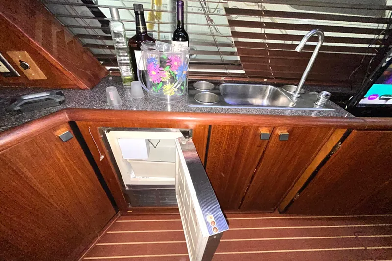 Slide: The Image of 1989 Bayliner 4588 Pilothouse wet bar with sink, ice maker. - 26