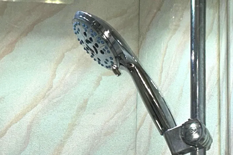 Slide: The Image of Chrome showerhead in a Bayliner 4588 Pilothouse yacht bathroom, 1989 model. - 53