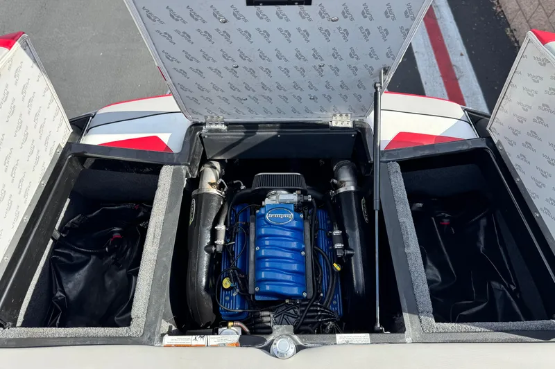 Slide: The Image of 2014 Supra SA350 engine compartment with open hatches, showcasing a blue engine. - 25