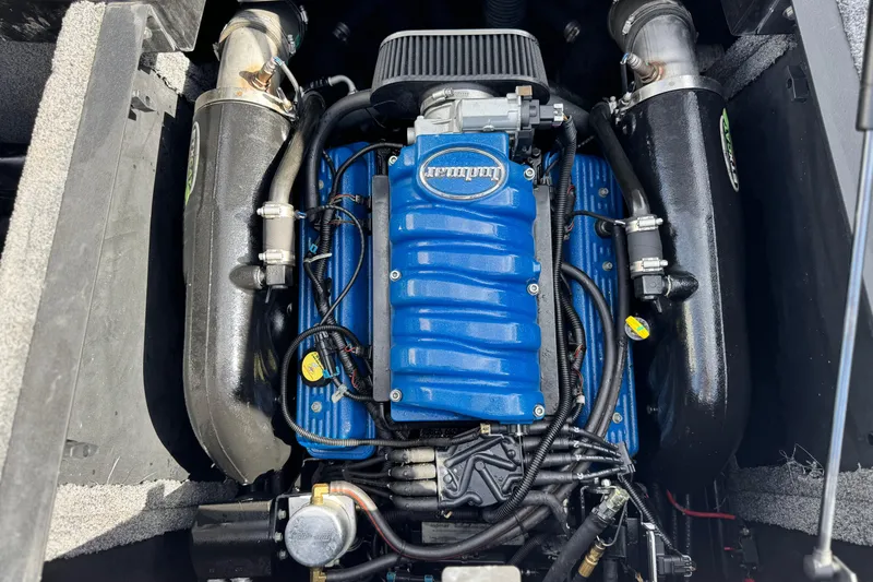 Slide: The Image of 2014 Supra SA350 engine with blue Indmar cover, detailed view. - 26