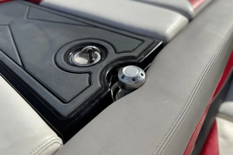 Slide: The Image of 2014 Supra SA350 boat interior with sleek seating and control panel. - 27