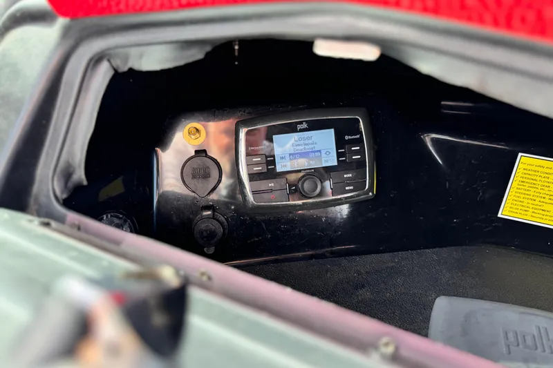 Slide: The Image of 2014 Supra SA350 audio system with Polk Bluetooth stereo in dashboard compartment. - 29