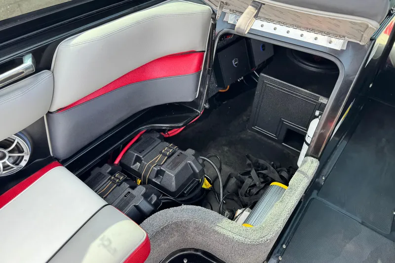 Slide: The Image of 2014 Supra SA350 interior storage with batteries and audio equipment. - 30