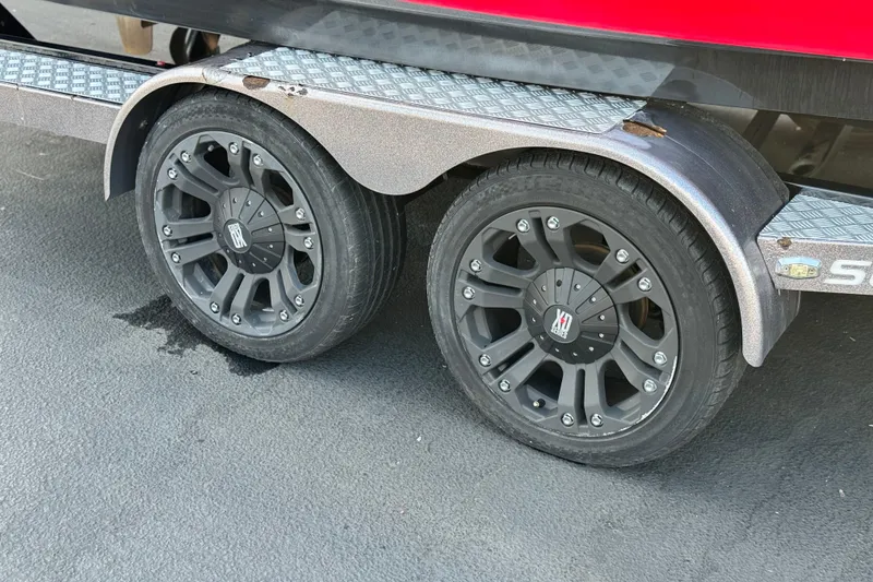 Slide: The Image of 2014 Supra SA350 trailer with black alloy wheels on asphalt. - 43