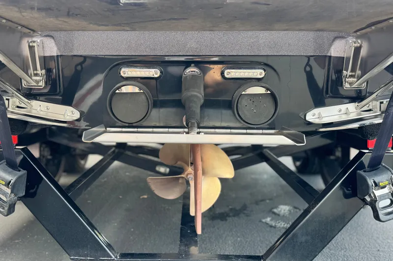 Slide: The Image of Rear view of 2014 Supra SA350 boat with propeller and trim tabs. - 8