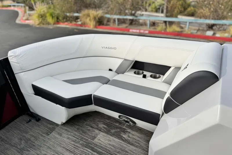 Slide: The Image of Luxurious seating in 2023 Viaggio Diamante 23E boat, featuring cup holders and modern design. - 13