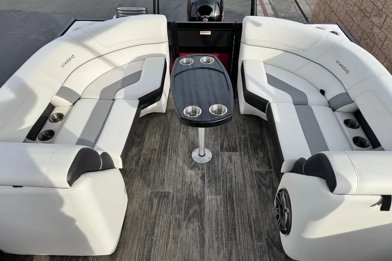 Slide: The Image of Luxurious seating area on 2023 Viaggio Diamante 23E boat with modern design and cup holders. - 17