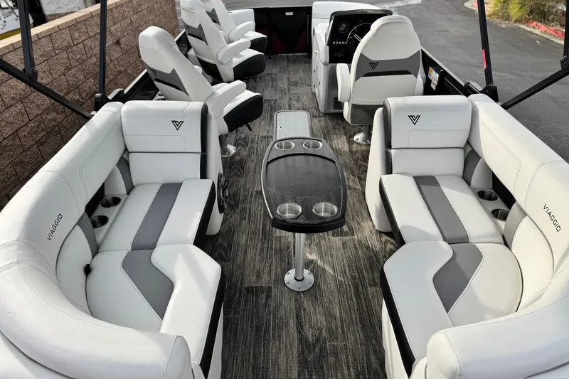 Slide: The Image of Luxurious interior of 2023 Viaggio Diamante 23E pontoon boat with stylish seating and table. - 19