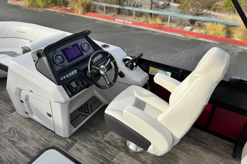 Slide: The Image of 2023 Viaggio Diamante 23E boat cockpit with modern steering and control panel. - 22
