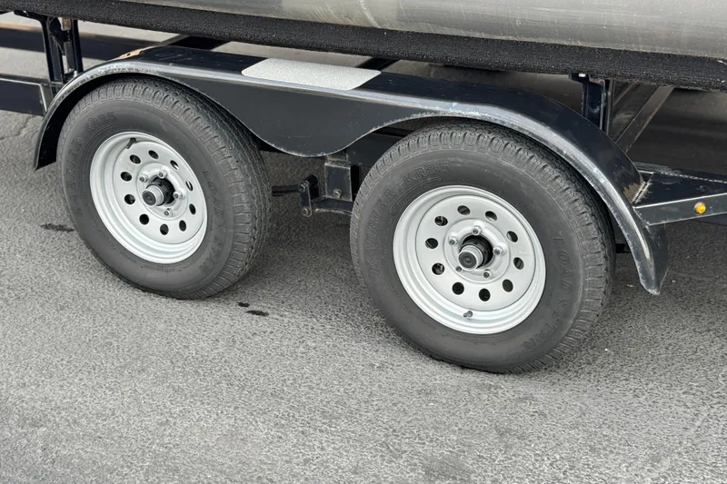 Slide: The Image of Trailer wheels of a 2023 Viaggio Diamante 23E on asphalt surface. - 28
