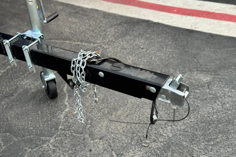 Slide: The Image of Trailer hitch of a 2023 Viaggio Diamante 23E with safety chain on asphalt. - 29