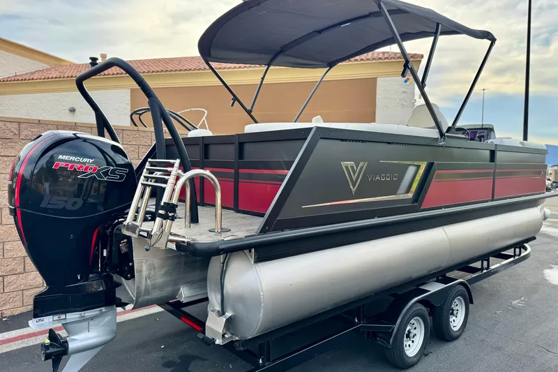 Slide: The Image of 2023 Viaggio Diamante 23E pontoon boat with Mercury Pro XS engine, parked on trailer. - 6