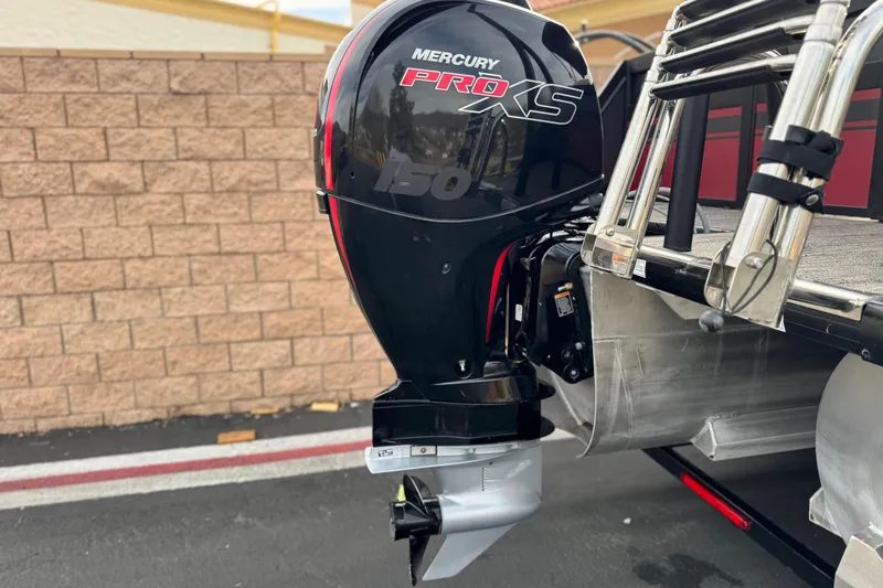 Slide: The Image of Mercury Pro XS 150 engine on 2023 Viaggio Diamante 23E boat, parked near brick wall. - 7