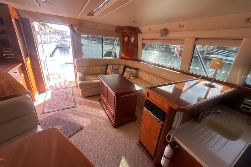 Slide: The Image of Luxurious 2007 Riviera Sport Fisherman yacht interior with elegant wood finishes and waterfront view. - 3