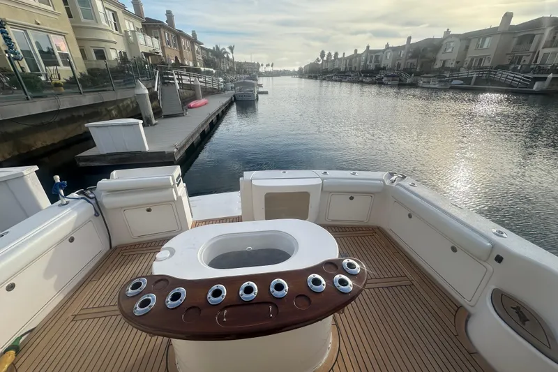 Slide: The Image of Riviera 37 Convertible 2007 with polished wooden table in cockpit. - 39