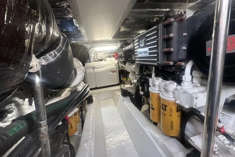 Slide: The Image of Open storage compartment on 2007 Riviera Sport Fisherman boat deck. - 46