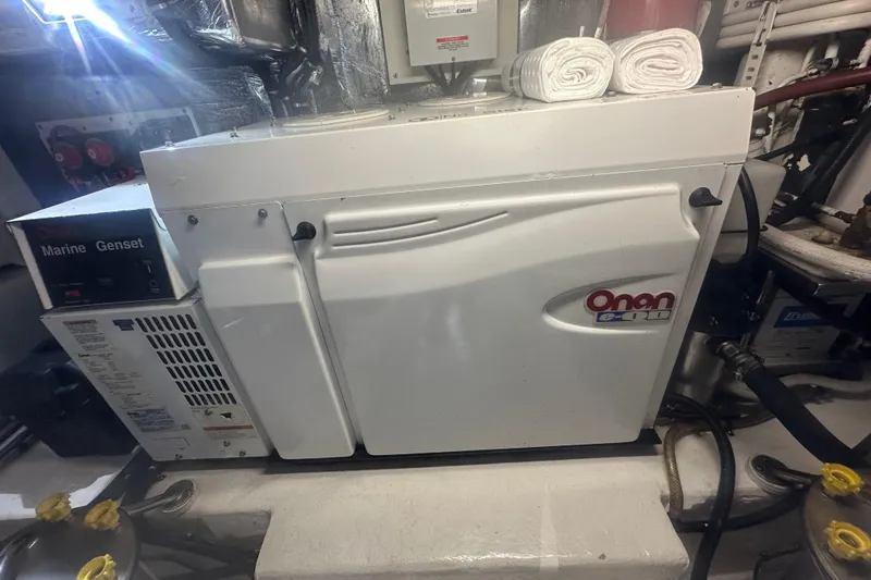 Slide: The Image of 2007 Riviera Sport Fisherman boat with "Finatics" welcome mat on wooden deck. - 47