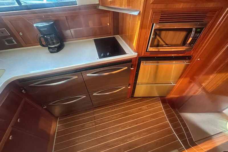 Slide: The Image of 2007 Riviera Sport Fisherman kitchen with microwave, stove, and coffee maker. - 7