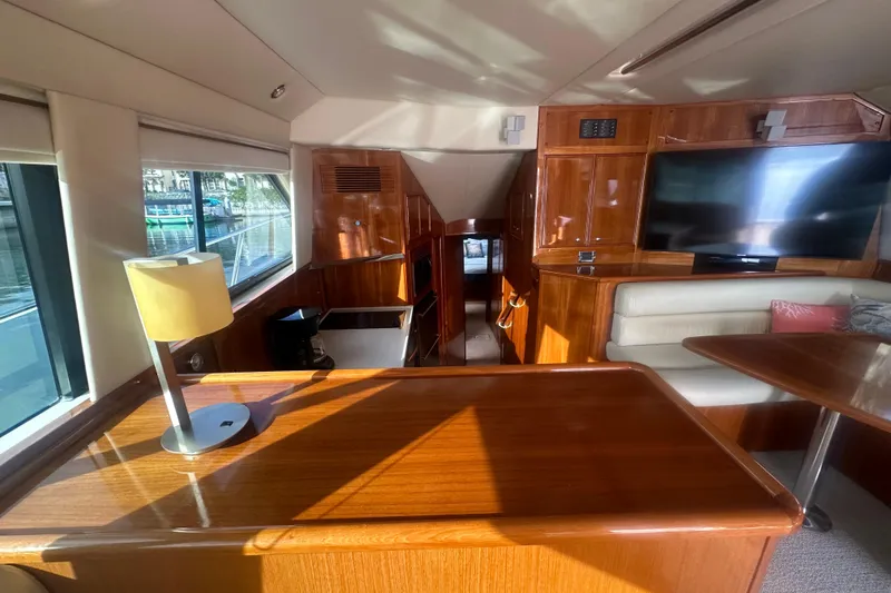 Slide: The Image of Luxurious 2007 Riviera Sport Fisherman yacht interior with wood finishes and modern amenities. - 9