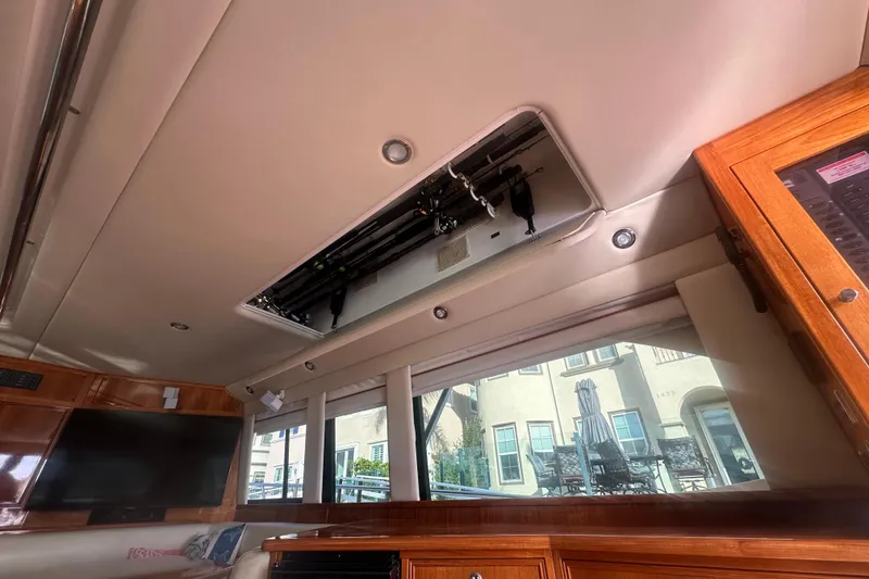 Slide: The Image of Interior view of 2007 Riviera Sport Fisherman boat with fishing rod storage. - 23