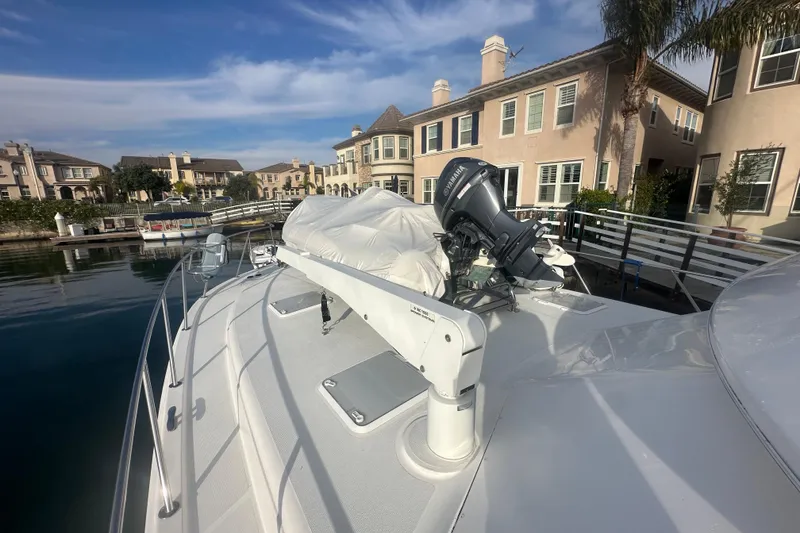 Slide: The Image of 2007 Riviera Sport Fisherman boat docked near waterfront homes. - 30