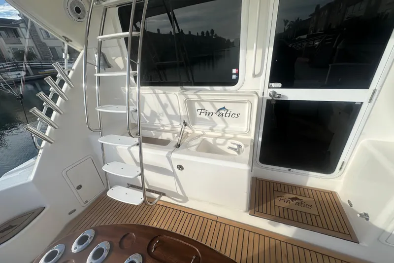 Slide: The Image of 2007 Riviera Sport Fisherman boat deck with ladder and teak flooring. - 36