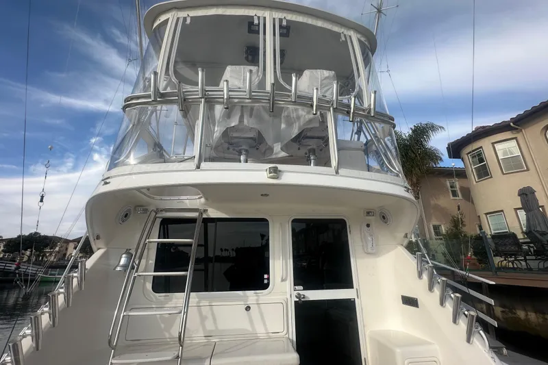 Slide: The Image of 2007 Riviera Sport Fisherman boat deck with ladder and sink, featuring "Finatics" logo. - 38