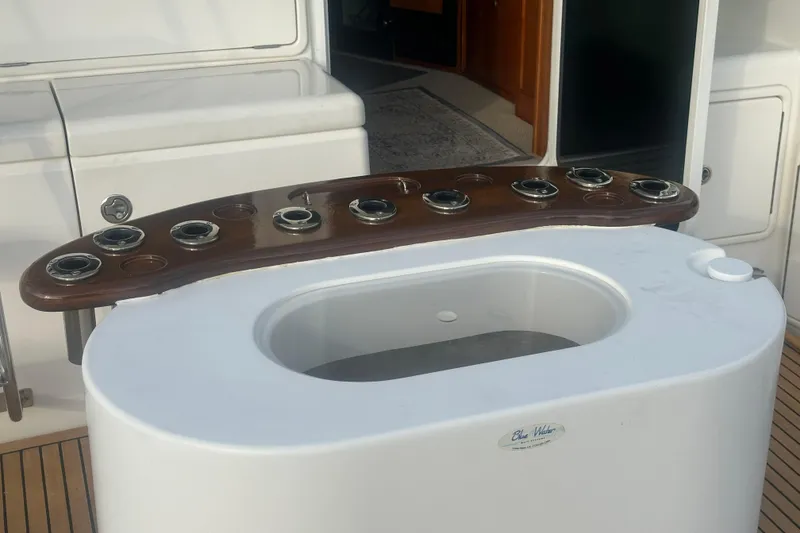 Slide: The Image of Riviera 37 Convertible 2007 with polished wooden table on deck. - 40