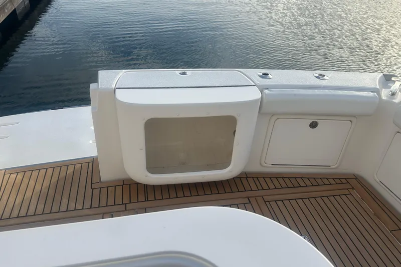 Slide: The Image of 2007 Riviera Sport Fisherman boat with rod holders and livewell on deck. - 42