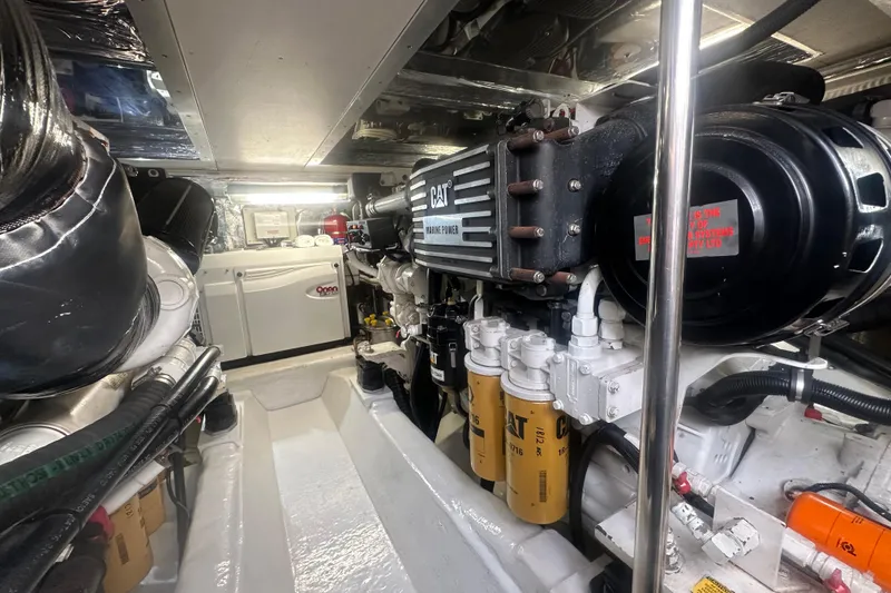 Slide: The Image of Engine room of 2007 Riviera Sport Fisherman with Reverso oil change system and filters. - 51
