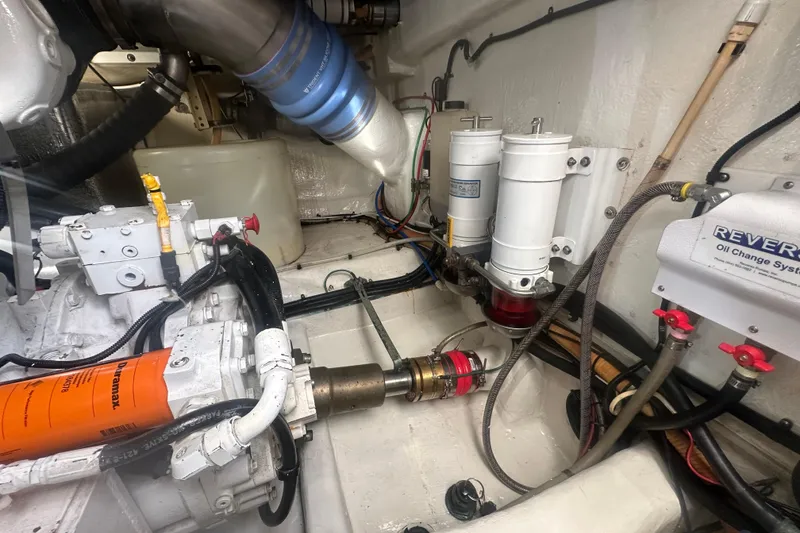 Slide: The Image of Engine room of a 2007 Riviera Sport Fisherman boat with Onan generator and equipment. - 52