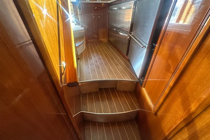 Slide: The Image of Interior of 2007 Riviera Sport Fisherman yacht with wooden flooring and stainless steel appliances. - 8
