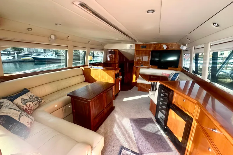 Slide: The Image of Luxurious interior of a 2007 Riviera Sport Fisherman yacht with elegant wood finishes. - 20