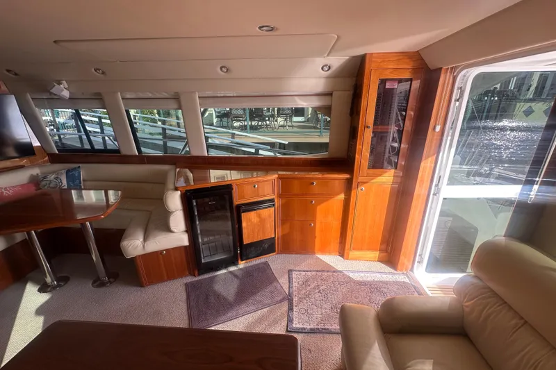 Slide: The Image of Luxurious interior of a 2007 Riviera Sport Fisherman yacht with elegant wood finishes. - 21