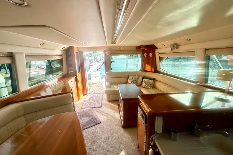 Slide: The Image of Luxurious interior of a 2007 Riviera Sport Fisherman yacht with elegant seating and wood finishes. - 4